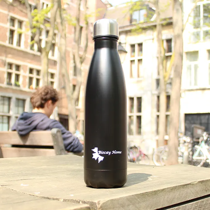 500 ml thermos bottle on a table in a park