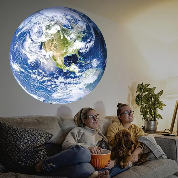 Family on their couch with the earth projecting above