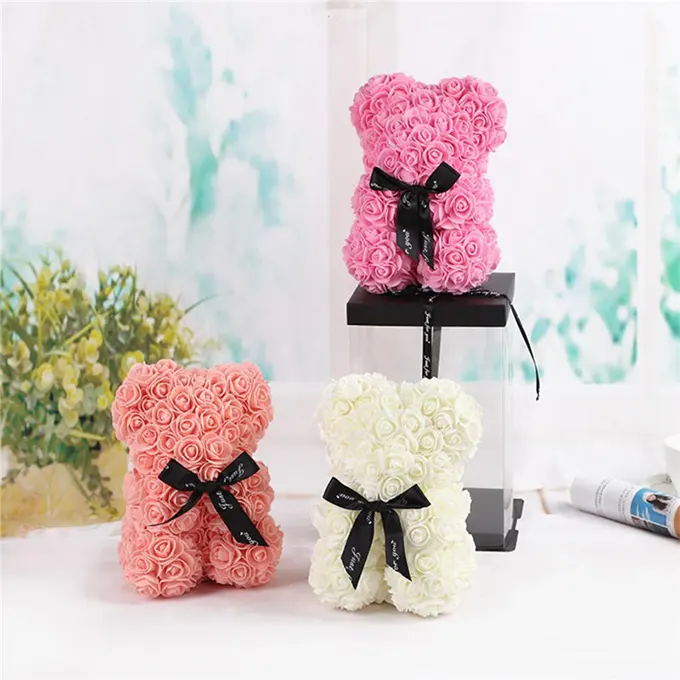 Plush roses of different colors with decorations and box