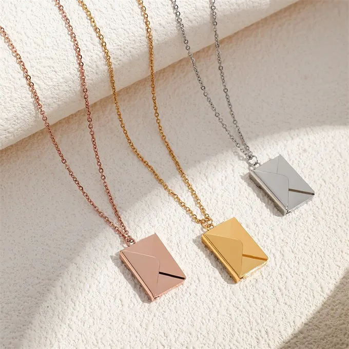 Gold, silver and pink necklace set with envelope pendant